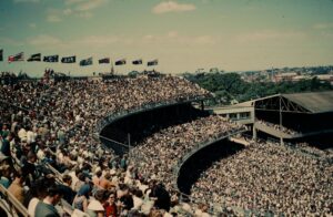 Historic view of a packed crowd at Melbourne Cricket Ground during an AFL match.